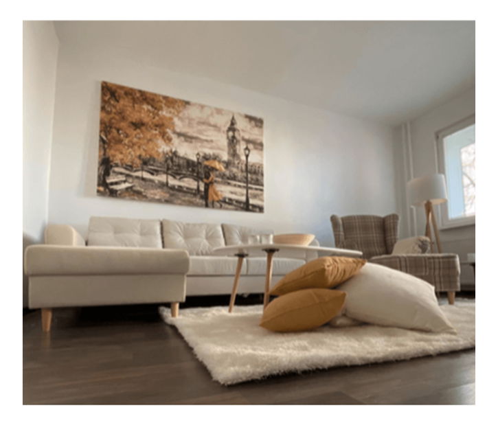 Křeslo ušiak s taburetem Aevo (hnědé káro)